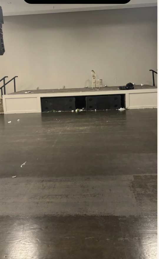 Venue floor before — plain dark concrete